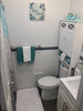 Sea Blue Bathroom Set in a Teal Bathroom